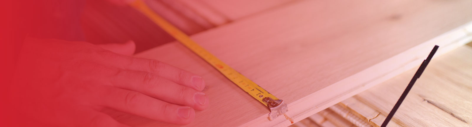 person measuring wood