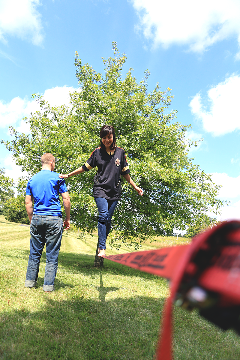 RevLocal employee balancing on slack line