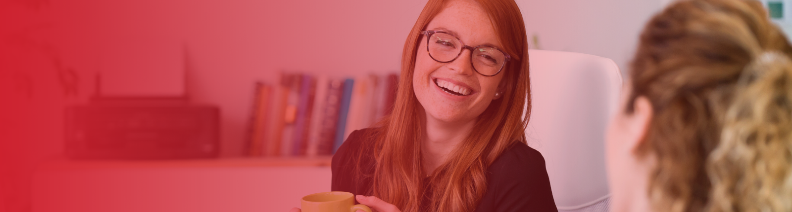 business woman smiling at an employee